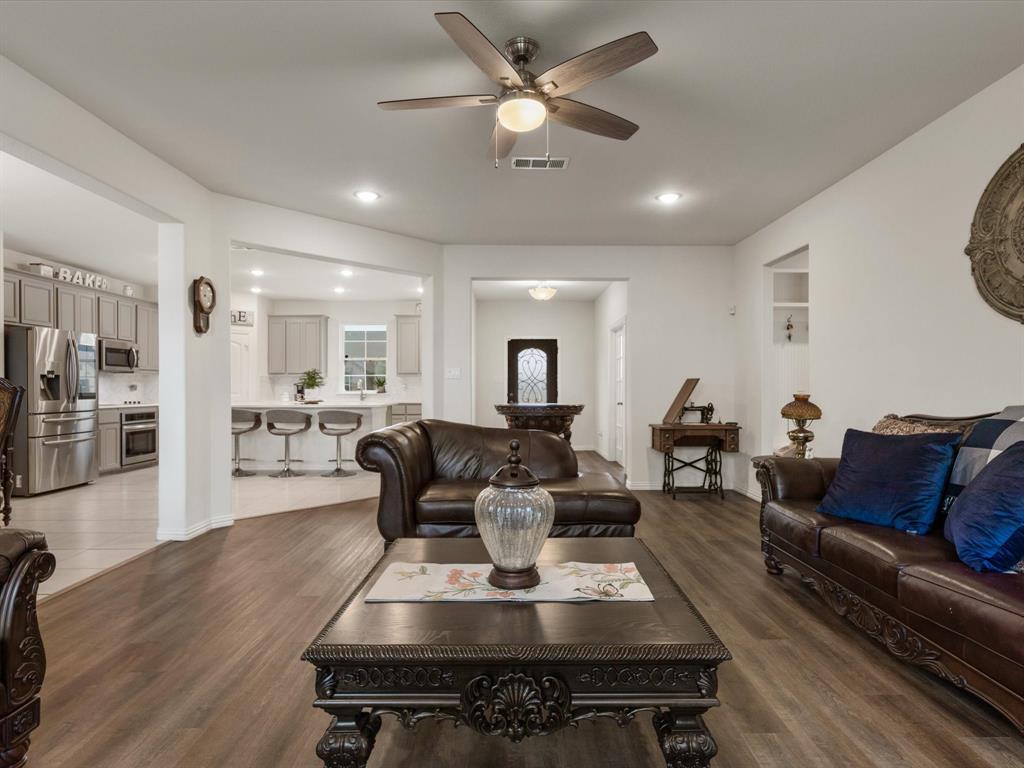 1009 Northern Oaks Court Springtown, TX 76082 - Photo 12 of 28 a living room with lots of furniture and view of kitchen