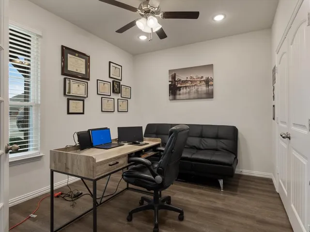 a view of a workspace with furniture and a workspace