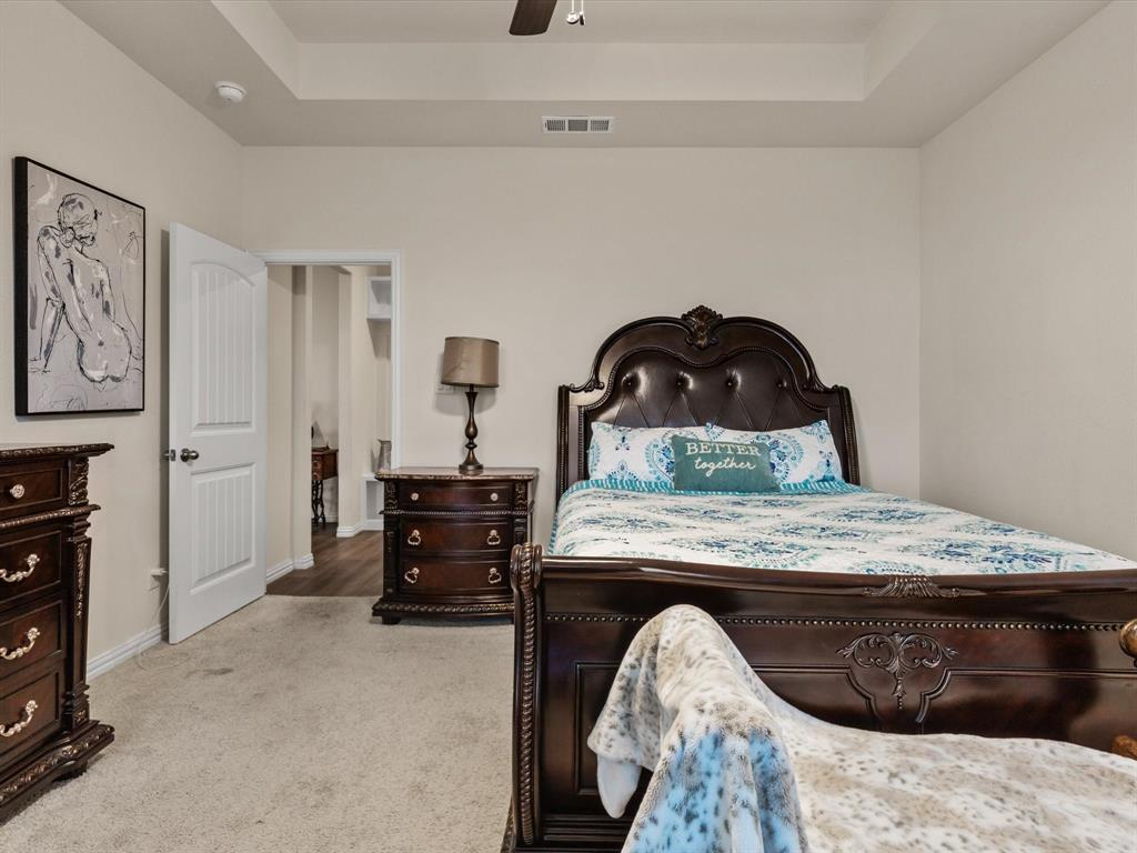 1009 Northern Oaks Court Springtown, TX 76082 - Photo 17 of 28 a bedroom with a bed and furniture