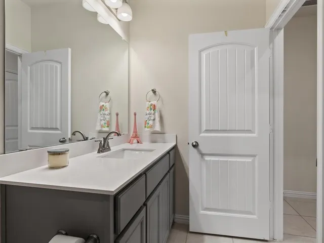 a bedroom with a bed and a table in it