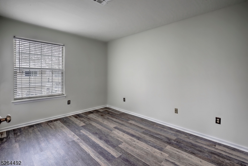70 High Pond Lane Bedminster, NJ 07921 - Photo 18 of 23 a view of a room with wooden floor and window