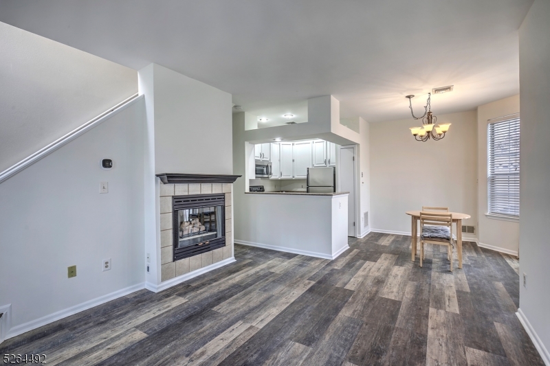 70 High Pond Lane Bedminster, NJ 07921 - Photo 3 of 23 a view of a kitchen with a sink and a fireplace