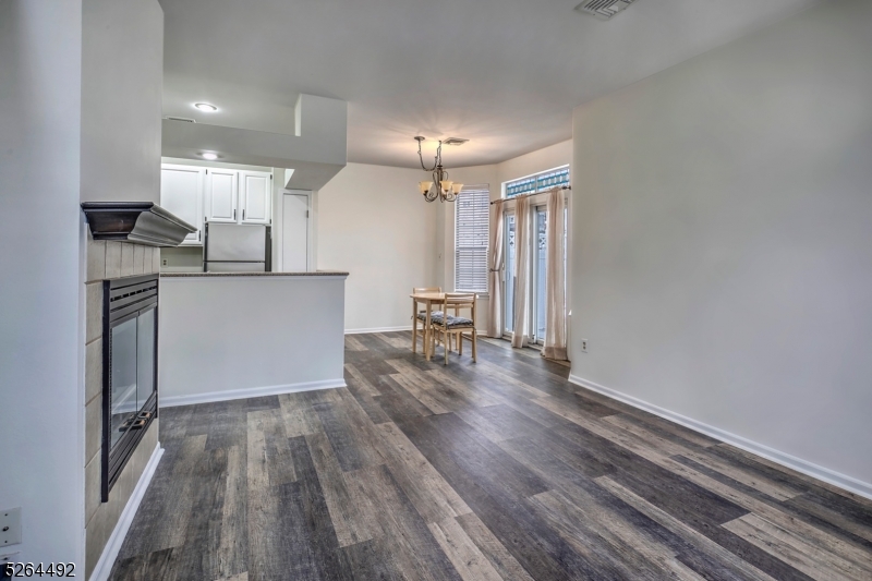 70 High Pond Lane Bedminster, NJ 07921 - Photo 4 of 23 a kitchen with a refrigerator and a wooden floor