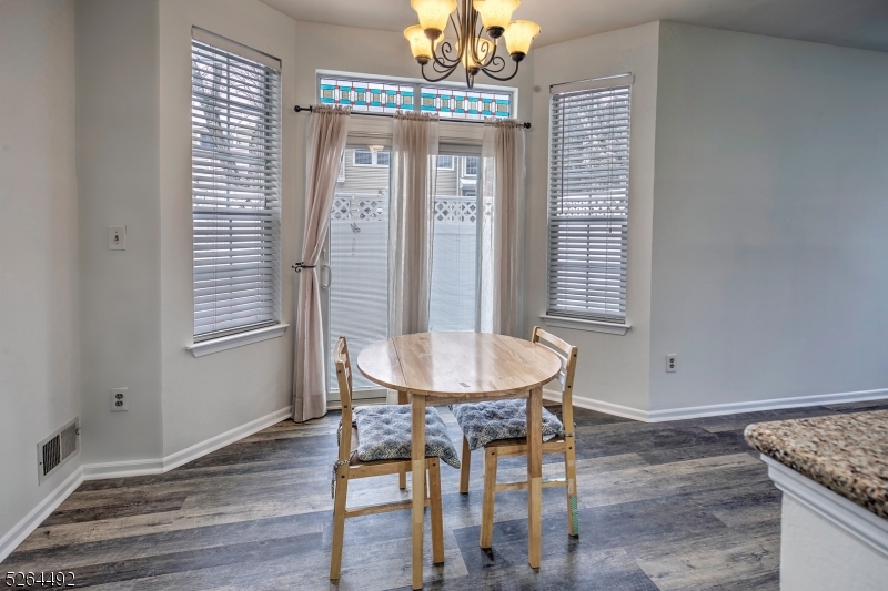 70 High Pond Lane Bedminster, NJ 07921 - Photo 9 of 23 a view of a dining room with furniture and window