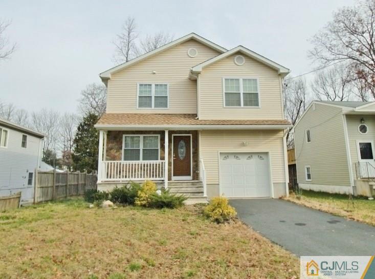 757 Magnolia Road North Brunswick, NJ 08902 - Photo 22 of 22 a front view of a house with a yard and garage
