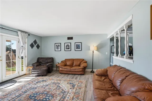 a living room with furniture window and couch