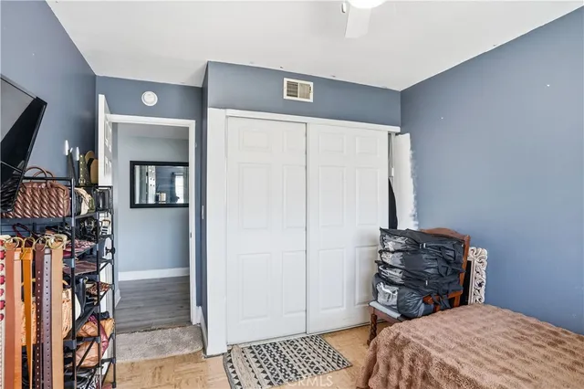 a bedroom with a bed and a mirror