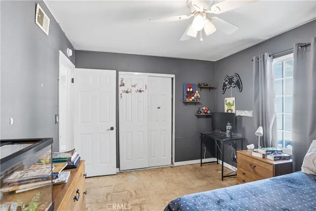 a living room with furniture a chandelier and a window