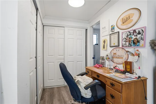a view of a room with a table and chairs