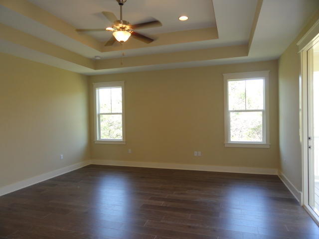 30 Prominence Square Inlet Beach Inlet Beach, FL 32461 - Photo 9 of 18 an empty room with wooden floor and windows