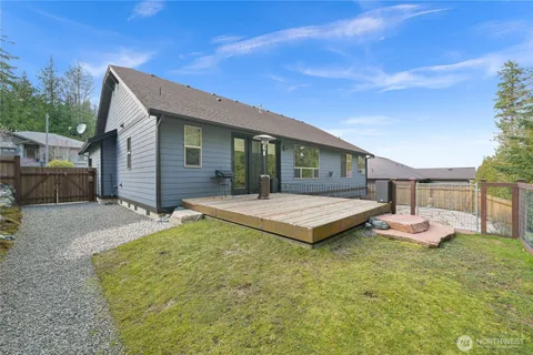 a front view of house with yard outdoor seating and barbeque oven