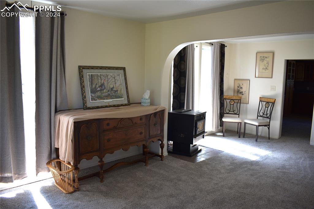 20490 Lemesany Road Calhan, CO 80808 - Photo 6 of 31 a bedroom with a bed and a chair