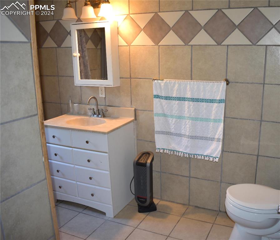 20490 Lemesany Road Calhan, CO 80808 - Photo 7 of 31 a bathroom with a toilet and a sink