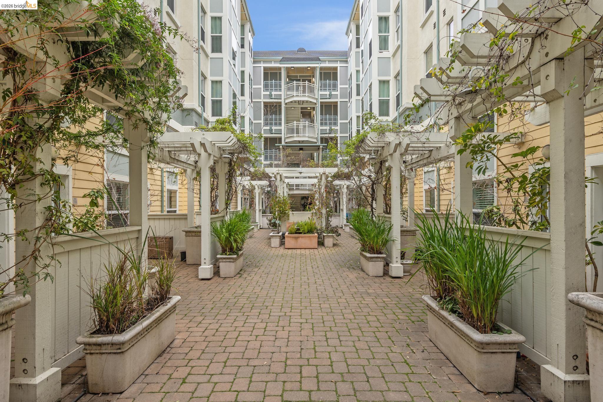 655 12th Street, Unit 120 Oakland, CA 94607 - Photo 40 of 51 View of community with a pergola and a patio area