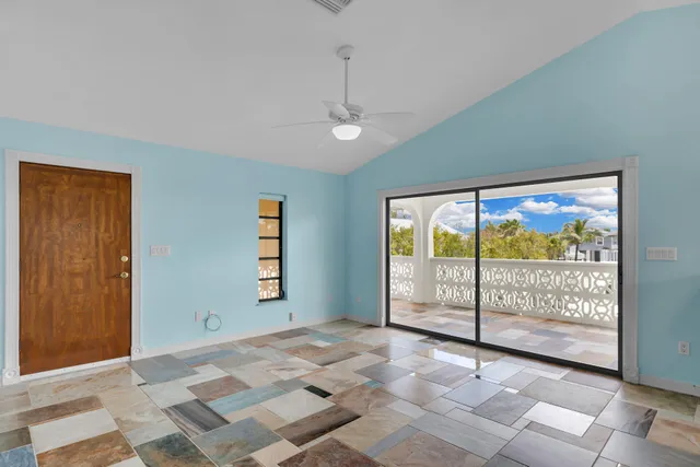 a view of a kitchen with kitchen island granite countertop lots of counter top space