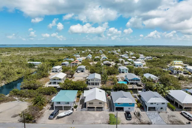 an aerial view of a house with a garden