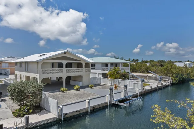 a front view of a house with a boat