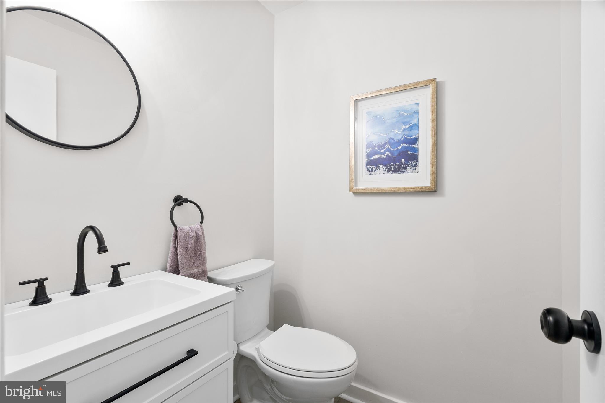 3908 Shakespeare Way Monrovia, MD 21770 - Photo 18 of 59 a bathroom with a toilet sink and mirror