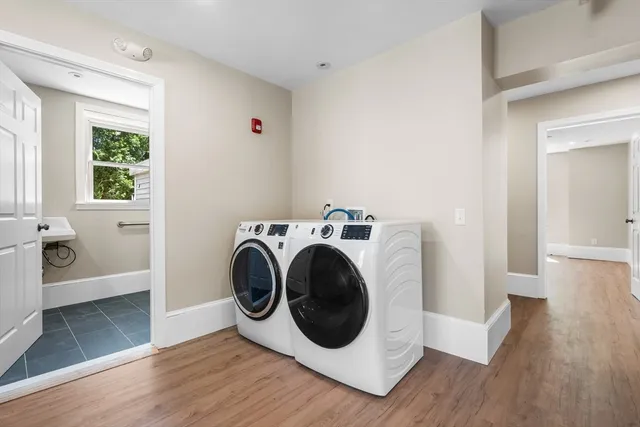 a view of a hallway with washer and dryer