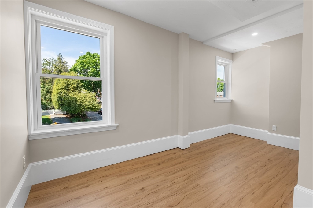 6 Windsor Street Andover, MA 01810 - Photo 19 of 34 wooden floor in an empty room with a window