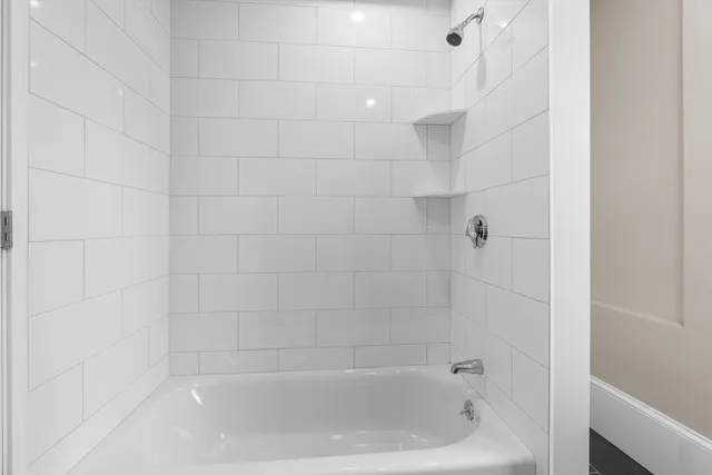 a close up of a bathtub curtain