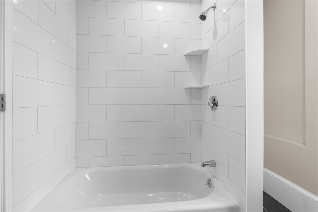 6 Windsor Street Andover, MA 01810 - Photo 22 of 34 a close up of a bathtub curtain