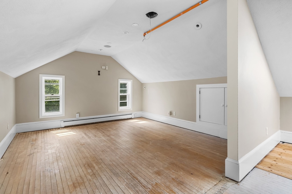 6 Windsor Street Andover, MA 01810 - Photo 25 of 34 a view of an empty room with wooden floor and a window