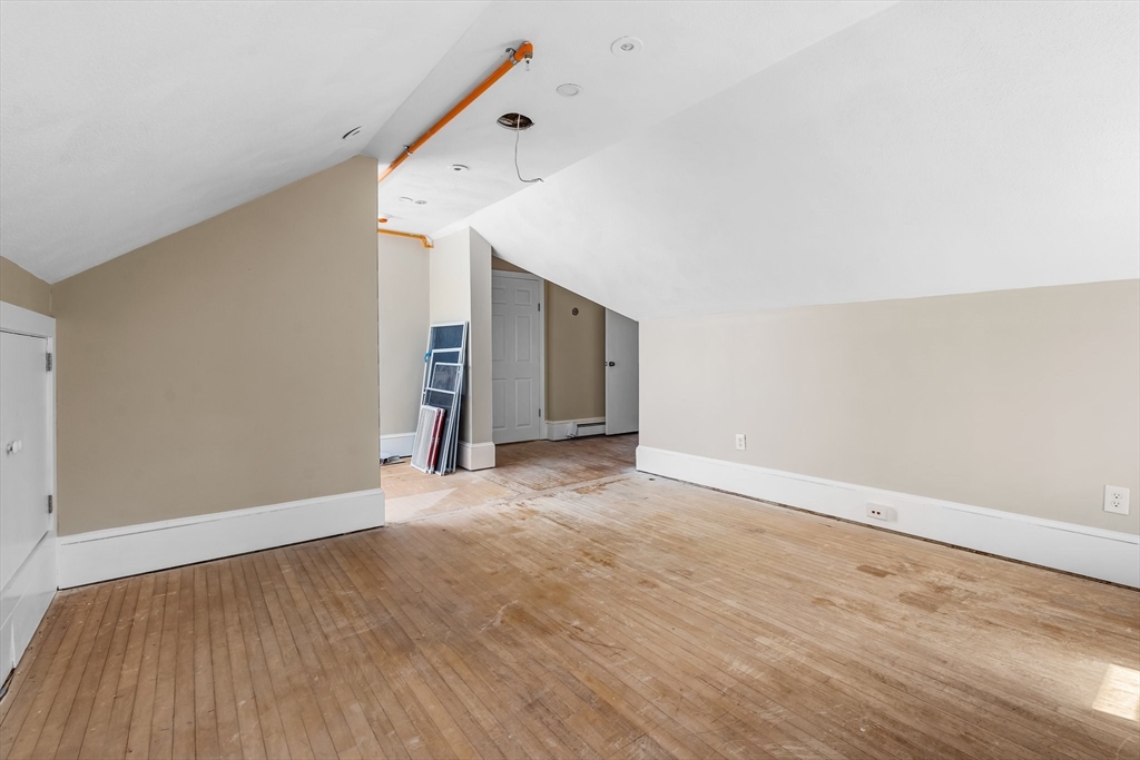 6 Windsor Street Andover, MA 01810 - Photo 26 of 34 a view of an empty room with wooden floor