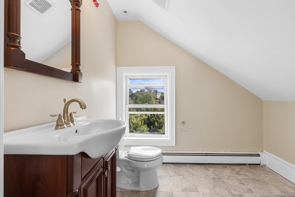 6 Windsor Street Andover, MA 01810 - Photo 27 of 34 a bathroom with a sink and a mirror
