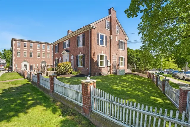 a view of a house and yard with green space