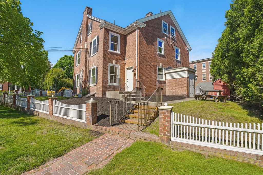 6 Windsor Street Andover, MA 01810 - Photo 5 of 34 a front view of a house with garden