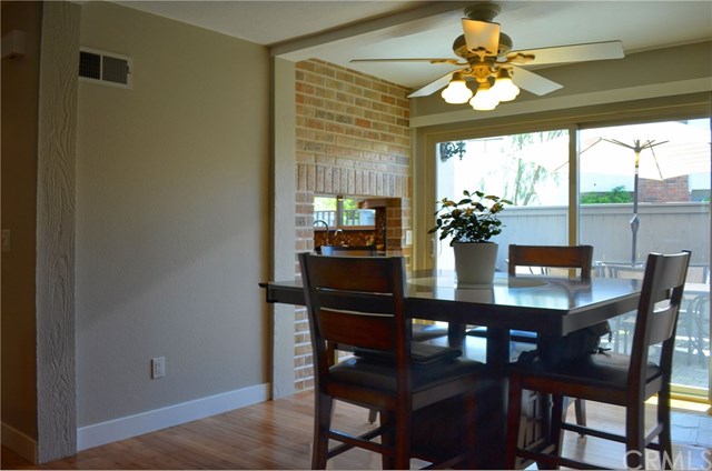 613 Rhine Lane Costa Mesa, CA 92626 - Photo 6 of 48 Dining has direct access to the patio through upgraded, double-paned patio doors.