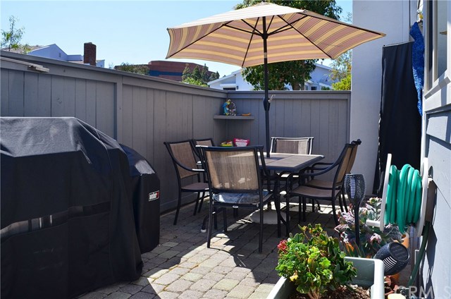 613 Rhine Lane Costa Mesa, CA 92626 - Photo 9 of 48 Fully paved patio with room for large table, bbq, propane heater, etc. has locking metal gate for your peace of mind.