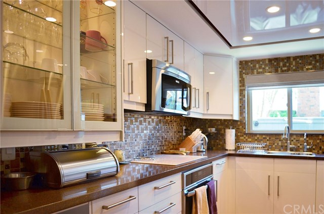 613 Rhine Lane Costa Mesa, CA 92626 - Photo 10 of 48 Lighted dinnerware display cabinet.