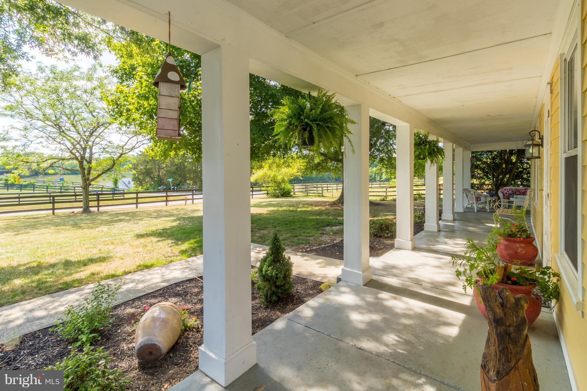 170 Camp Selden Road Fredericksburg, VA 22405 - Photo 2 of 29 a view of a porch with furniture and garden