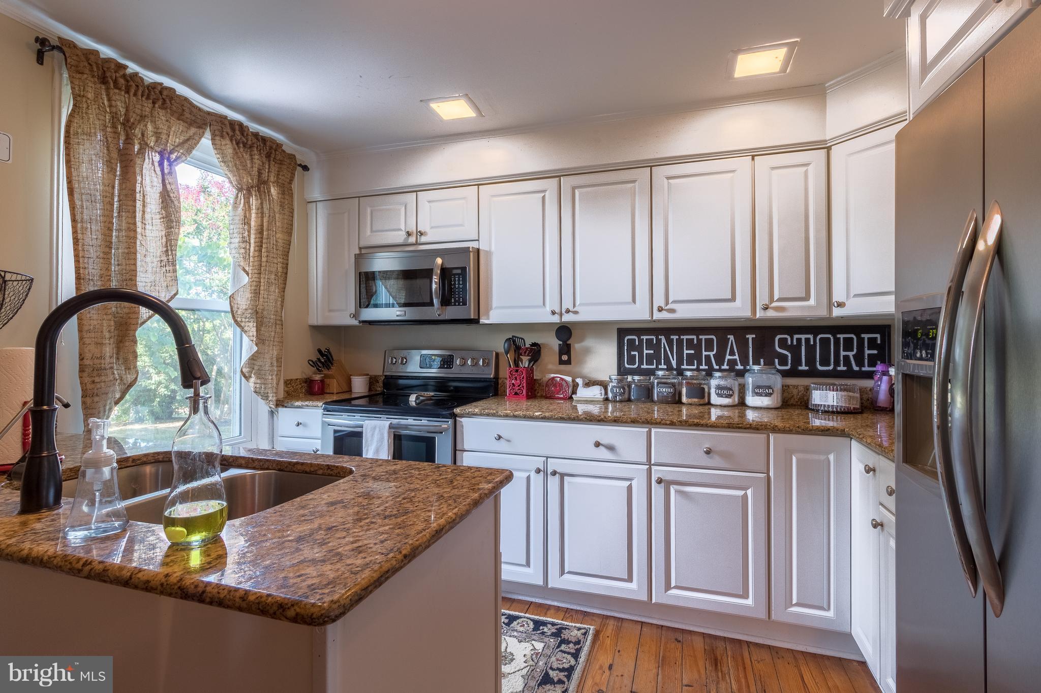 170 Camp Selden Road Fredericksburg, VA 22405 - Photo 12 of 29 a kitchen with stainless steel appliances granite countertop a stove top oven a sink and dishwasher