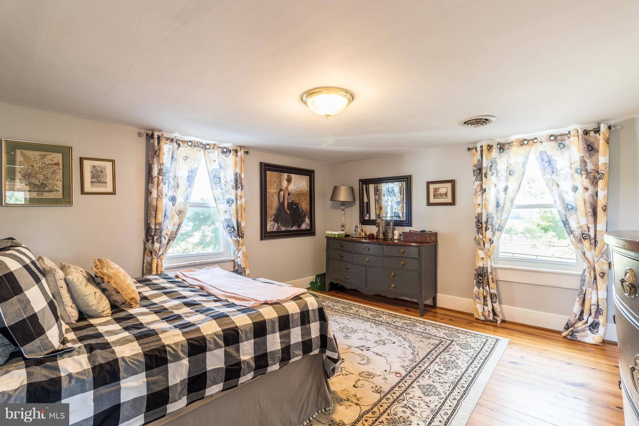 170 Camp Selden Road Fredericksburg, VA 22405 - Photo 19 of 29 a bedroom with a bed and a couch