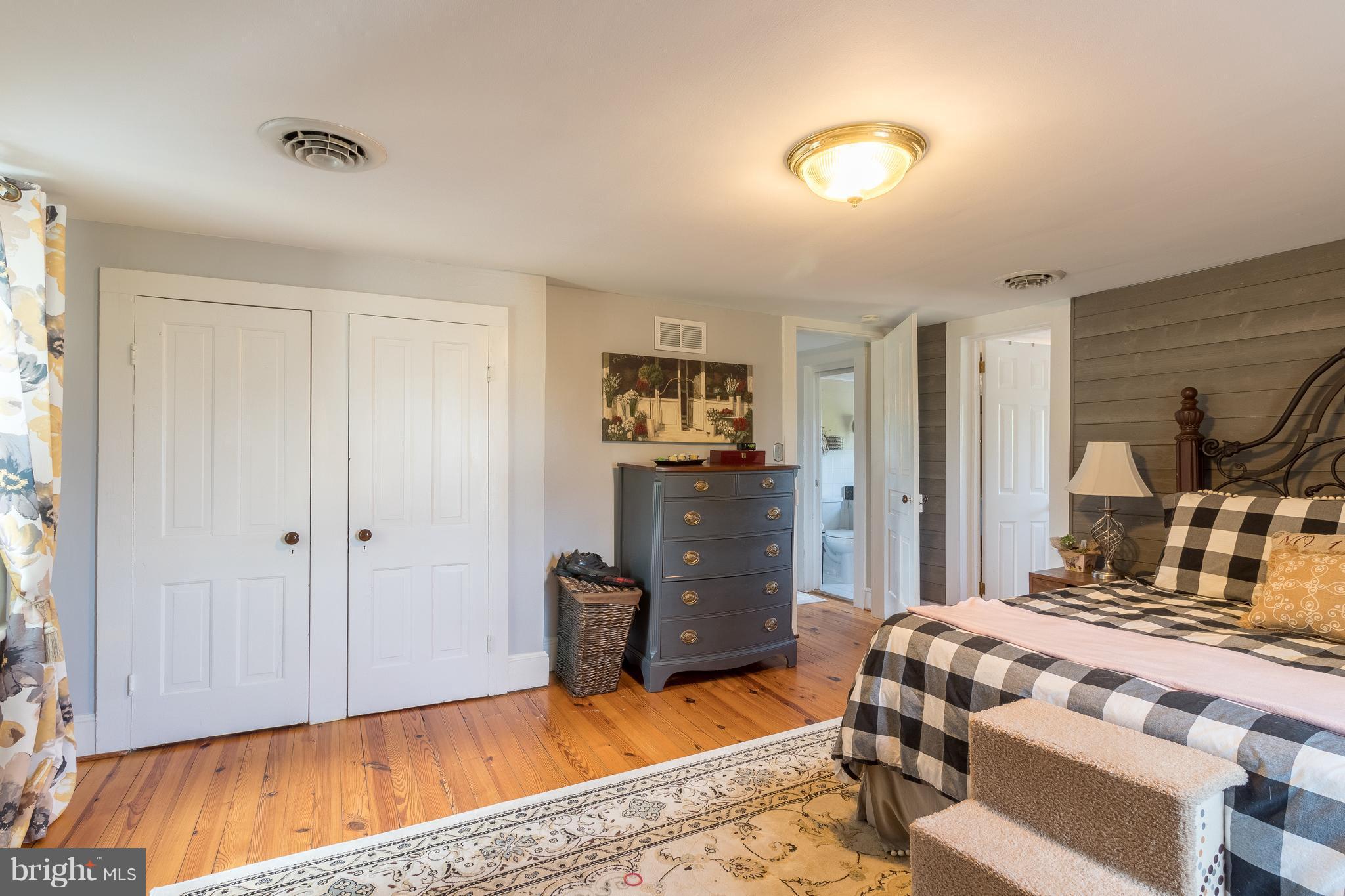 170 Camp Selden Road Fredericksburg, VA 22405 - Photo 20 of 29 a bedroom with a bed and wooden floor