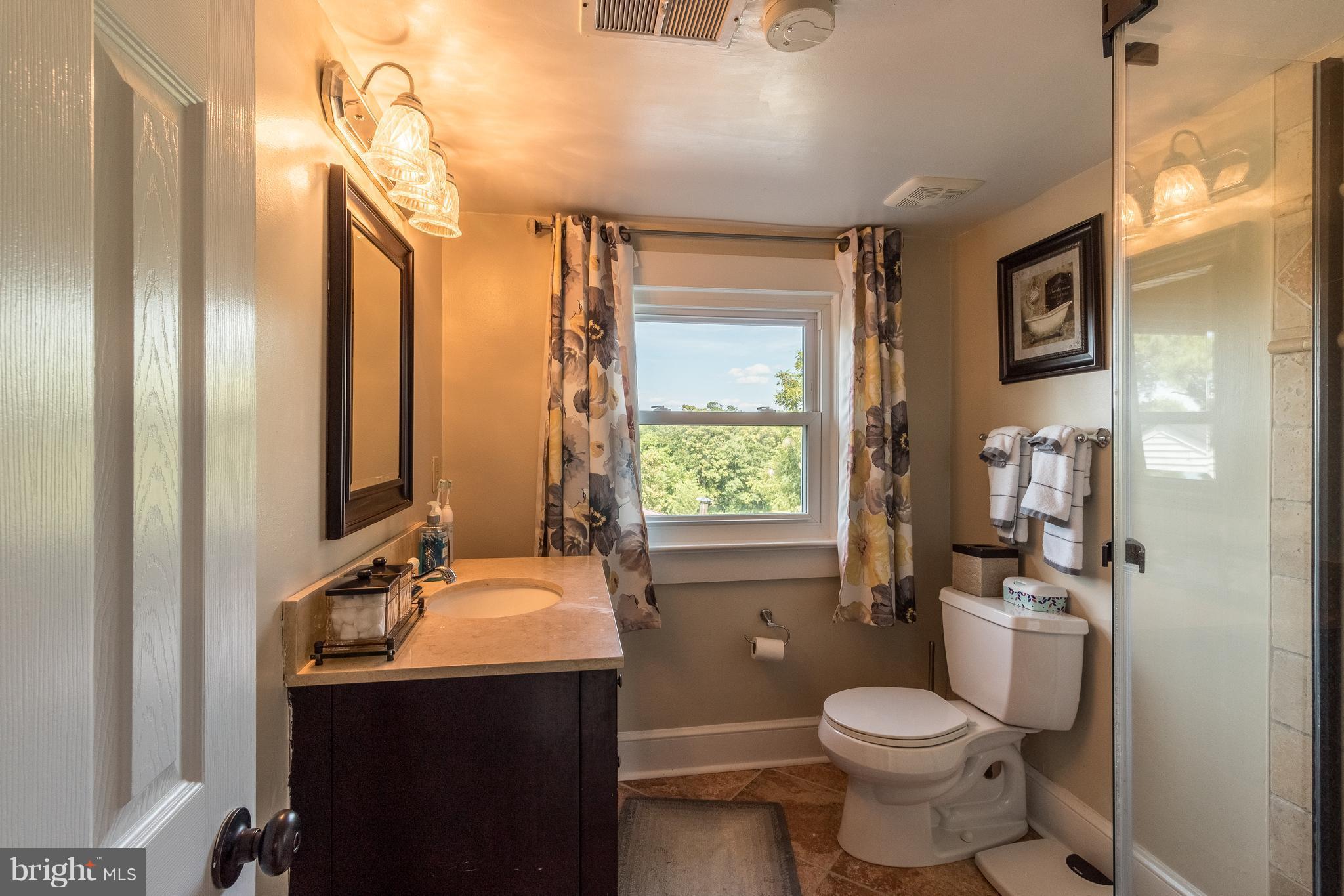170 Camp Selden Road Fredericksburg, VA 22405 - Photo 21 of 29 a bathroom with a double vanity sink toilet and shower