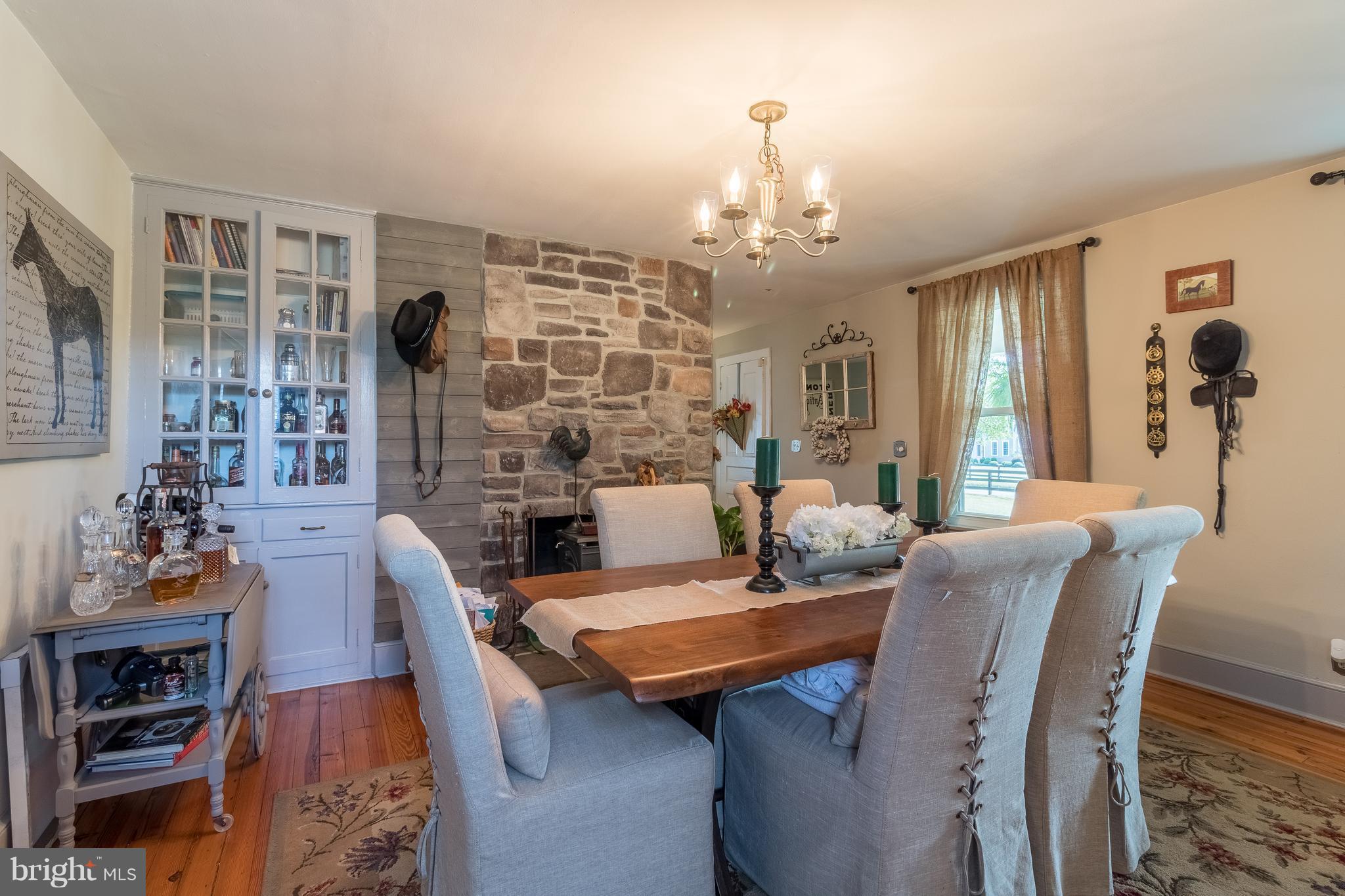 170 Camp Selden Road Fredericksburg, VA 22405 - Photo 6 of 29 a view of a dining room with furniture a chandelier and wooden floor