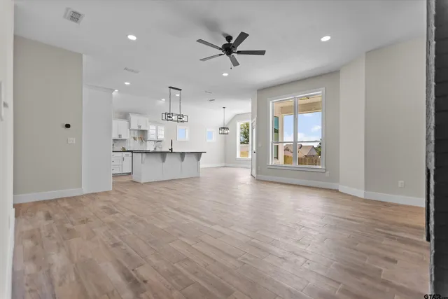 a view of a kitchen with a sink and a window