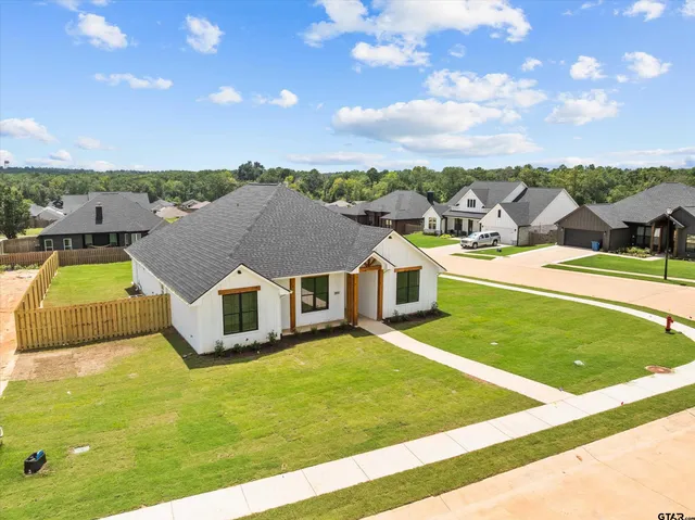 a view of a house with a big yard