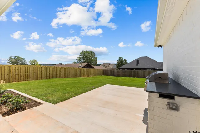 a view of a garden with an outdoor space