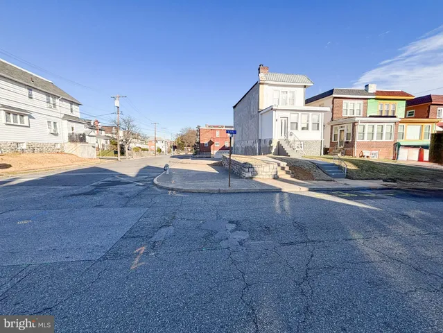 a view of multiple houses with a yard
