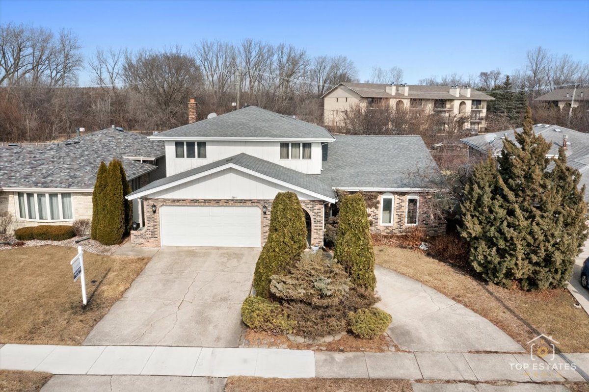 5844 West 124th Street Alsip, IL 60803 - Photo 1 of 44 a front view of a house with a yard
