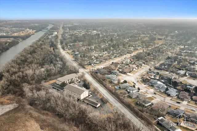 an aerial view of residential building with parking