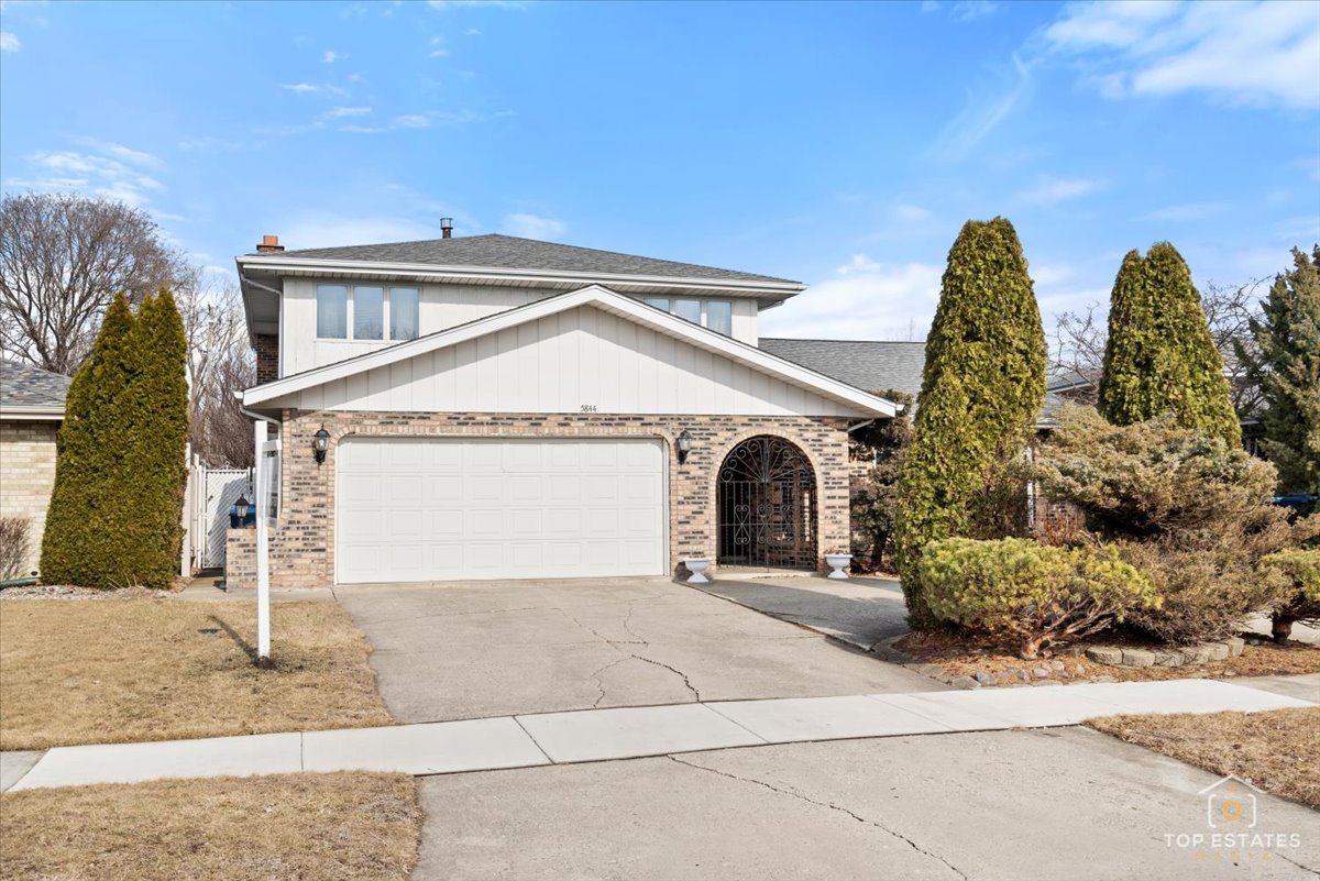 5844 West 124th Street Alsip, IL 60803 - Photo 7 of 44 a front view of a house with garden