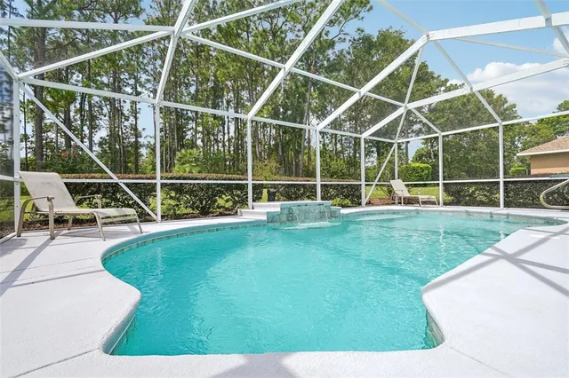 a view of yard with swimming pool