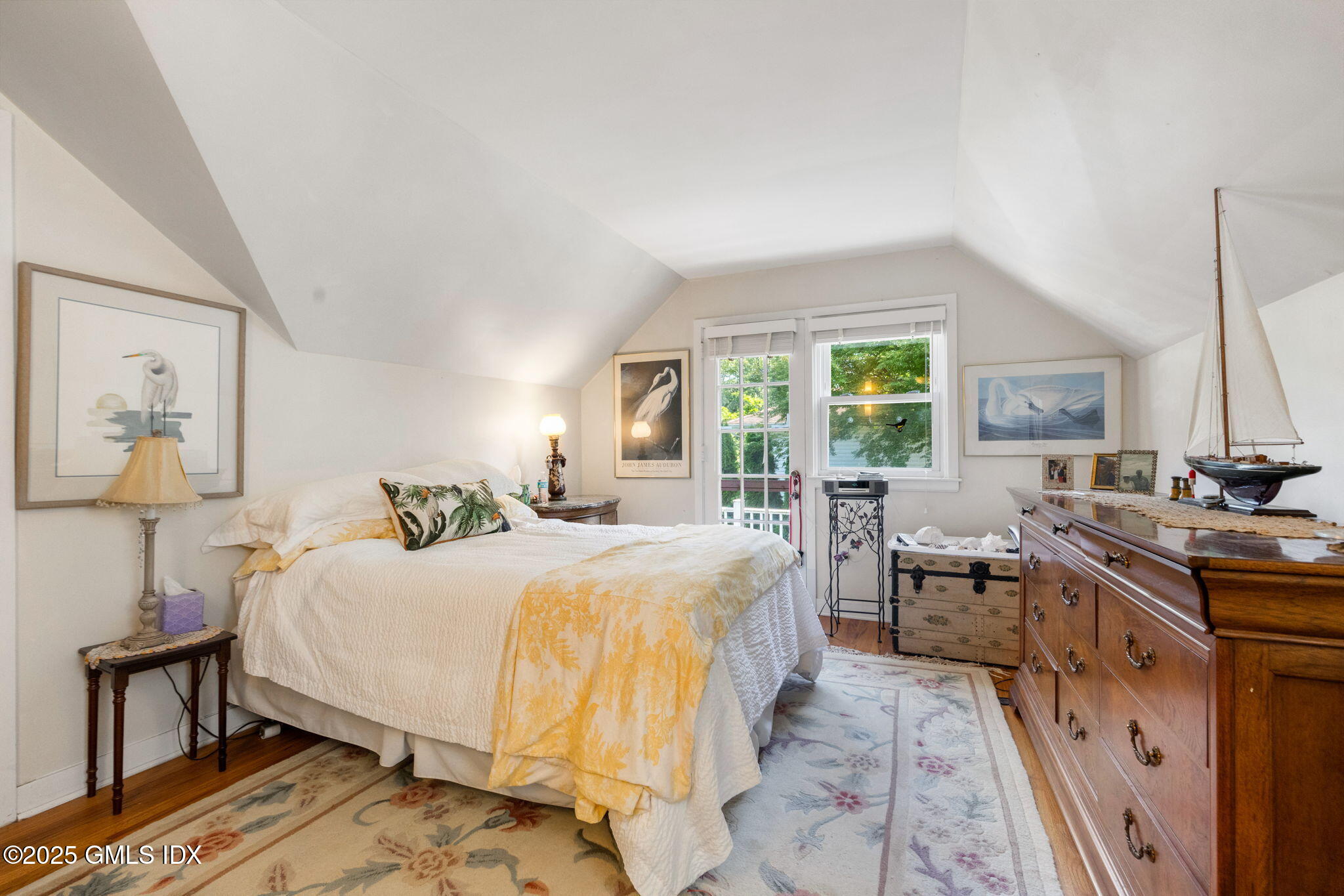 10 Pilgrim Drive Greenwich, CT 06831 - Photo 12 of 18 a bedroom with a bed and wooden floor