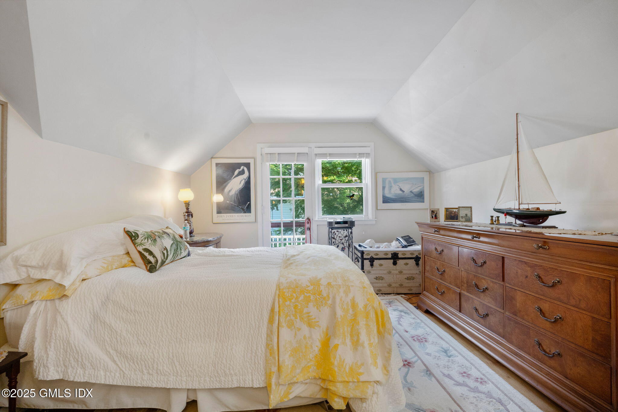 10 Pilgrim Drive Greenwich, CT 06831 - Photo 13 of 18 a bedroom with a bed and large windows